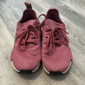 Maroon colored Addias sneakers